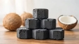 Natural coconut charcoal briquette stacked ready for use showing eco-friendly sustainable burning product